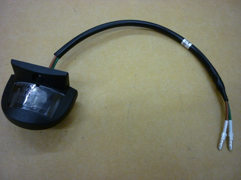 Фонарь освещения номерного знака