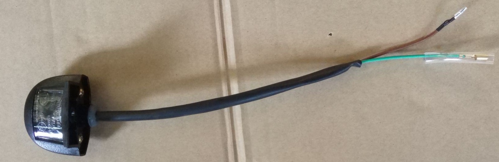 Фонарь освещения номерного знака