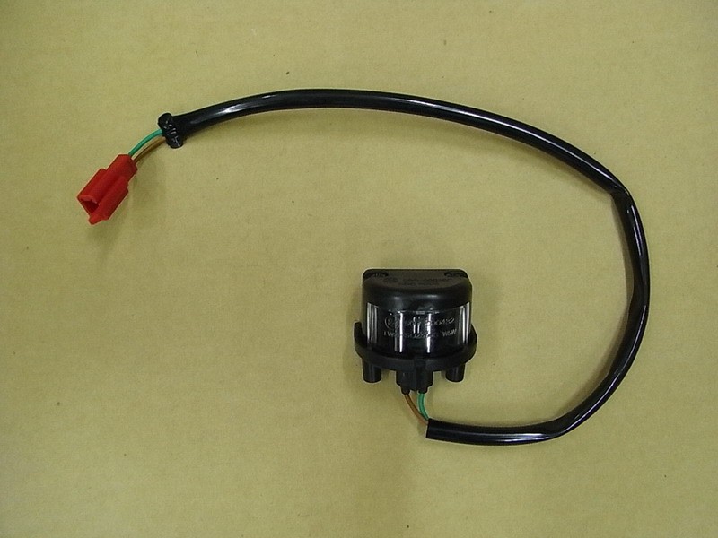 Фонарь освещения номерного знака