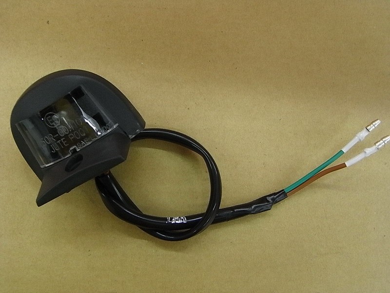 Фонарь освещения номерного знака