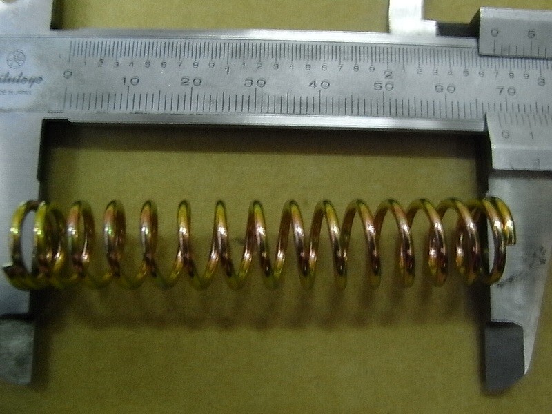 Пружина рычага эксцентрика заднего тормоза